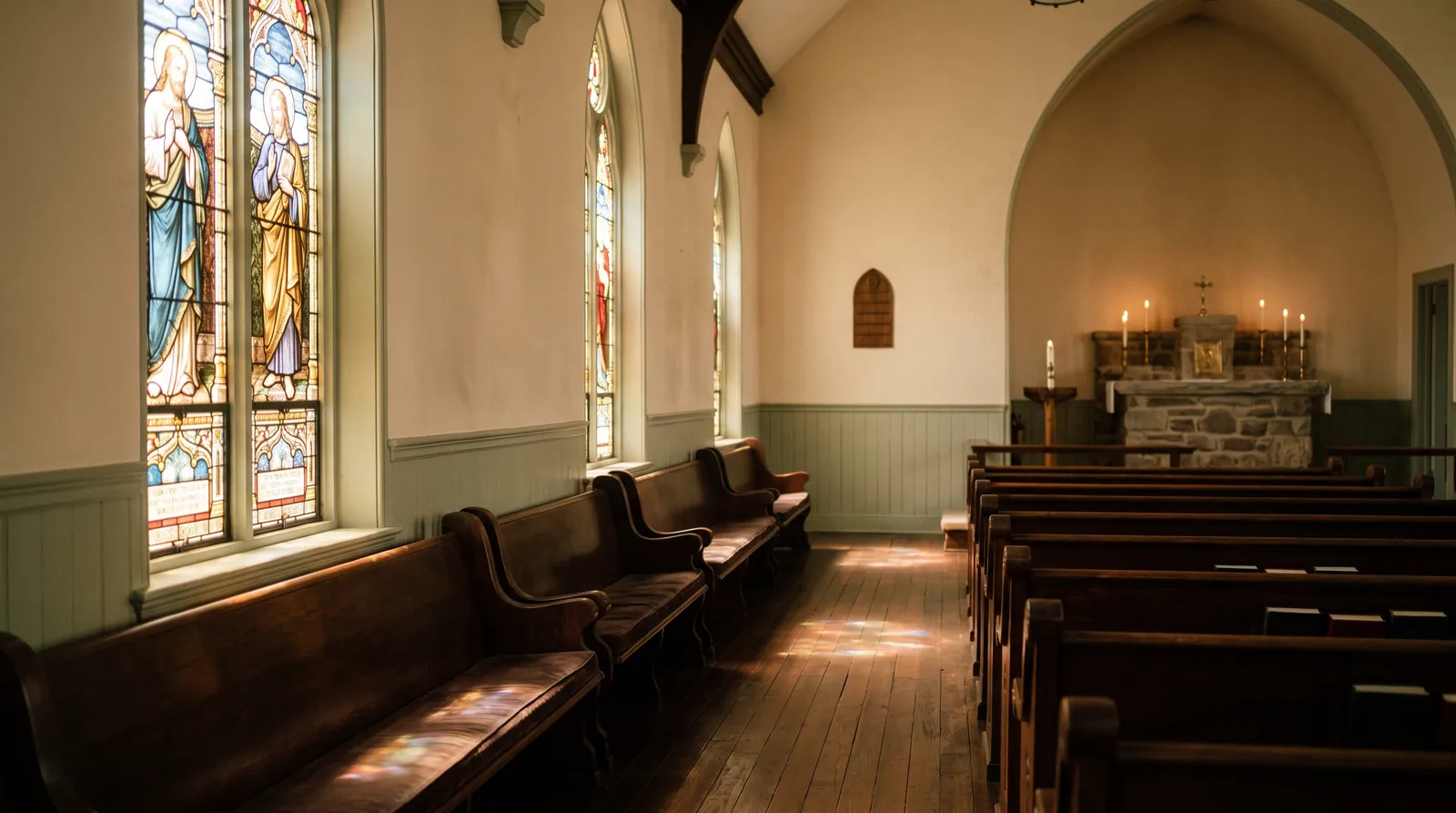 Inside the sanctuary — warm light through stained glass